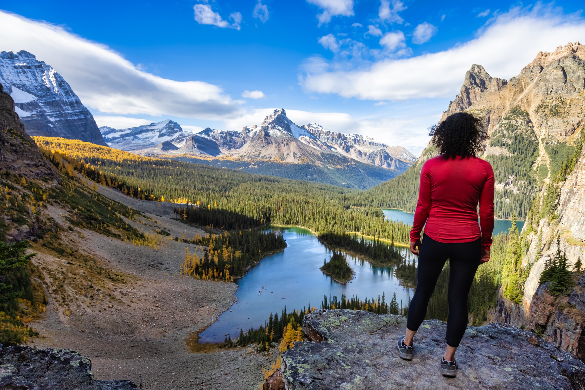 Adventurous White Caucasian Woman Hikes in Canadian Rocky Mountains